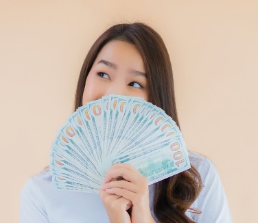 Asian Woman Holding Money (2)