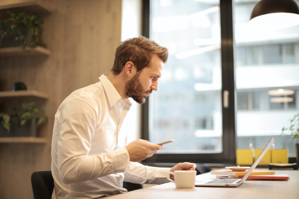 Man Working While Drinking Coffe